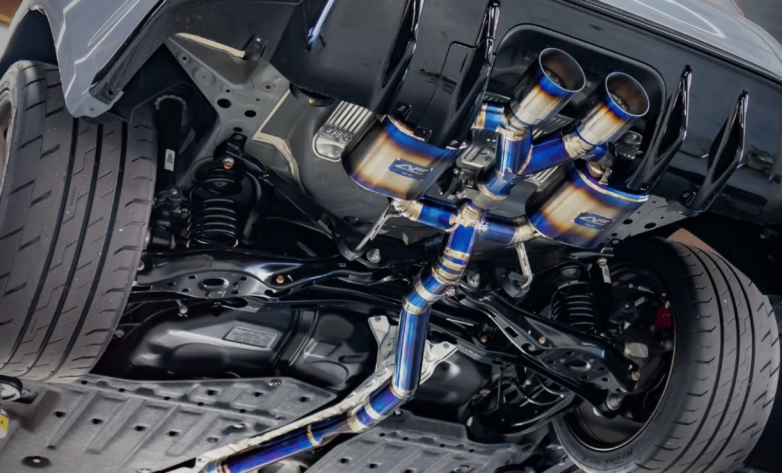 Performance exhaust system installed beneath a vehicle